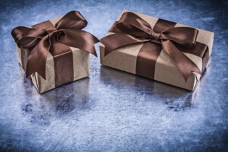 Wrapped gift boxes with brown ribbon horizontal version holidays concept