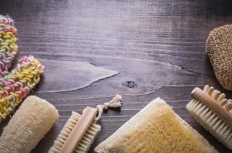 Set of bath accessories on wooden board