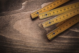Wooden meter on wood board horizontal image construction concept