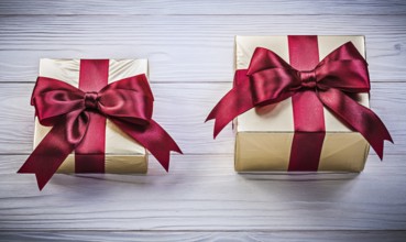Packed gift boxes on wooden board directly above holidays concept