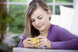 A young woman with tee cup