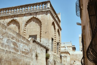 Traditional middle eastern stone houses on a street of Middle Eastern city. Streets of Mardin,