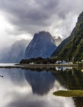 New Zealand. Storm clouds cover the sky over the famous ocean fjord Milford Sound. Port of tourist