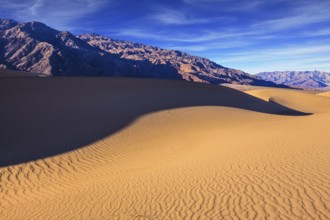 Mesquite Flat Sand Dunes. Bright solar morning in picturesque part of Death Valley. Slopes of sandy