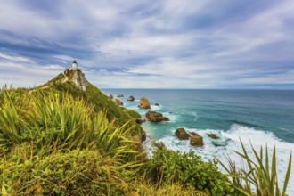 Nugget Point Lighthouse on the cape of the Kathlins coast of the South Island. Travel to New