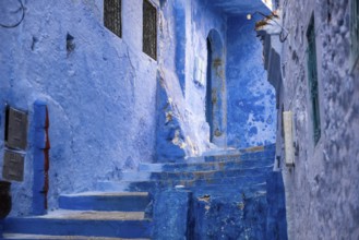 Vibrant blue colored alley in downtown Chefchaouen, Morocco