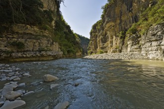 Osumi Canyon in Albania fat river level while walking through the water