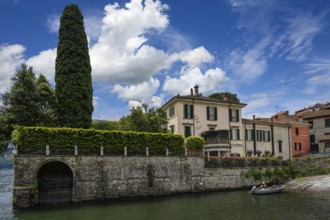 A view of a villa on Lake Como by an American actor in summer in Italy