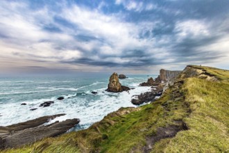 Portio beach. Rocky coastline of the Atlantic Ocean. Spanish coast, Cantabria. Stormy autumn day in