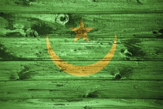 Mauritania flag on wooden planks background wood flag