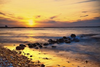 Sunset on the beach of Niendorf on the baltic sea