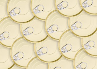 A lot of round golden cans with keys