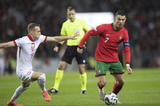 Football match, captain Cristiano RONALDO CR7 Portugal on the ball on the right in a duel with