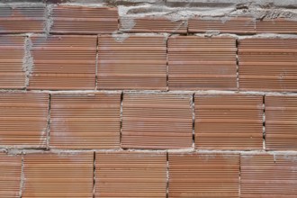 Building brick put in the wall, representing strong european way to build the houses