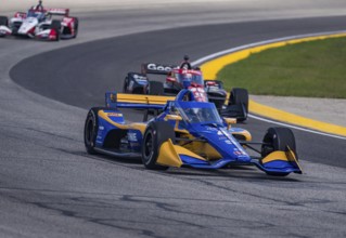NTT INDYCAR SERIES driver, KYFFIN SIMPSON (R) (4) (BRB) of Bridgetown, Barbados races through the