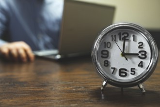The clock shows three o'clock in the afternoon. Working hours are in full swing