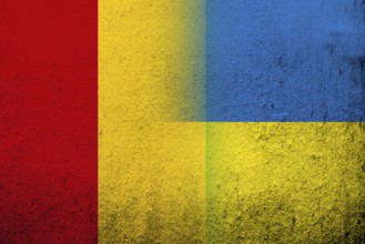The Republic of Guinea National flag with National flag of Ukraine. Grunge background