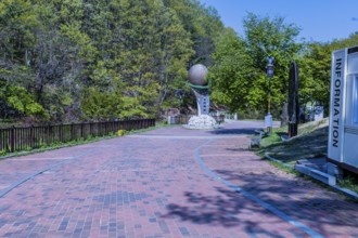 Yongdong, South Korea, April 28, 2020: Sculpture of and red brick walkway at entrance to Okgye