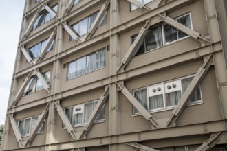 Building with visible steel reinforcement for earthquake resistance