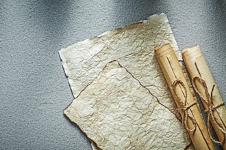 Vintage paper rolls on grey background