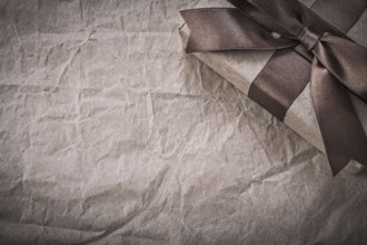 Wrapped present box on wrapping paper holidays concept