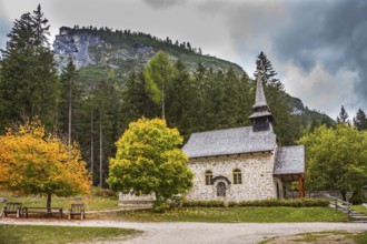 Church on the Alpine lake Lago di Braies. The concept of walking and eco-tourism. Travel to the