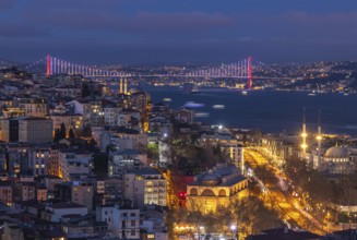 A picture of the buildings of the Beyoglu district and the Bosphorus Bridge at night