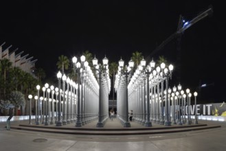 A picture of Urban Light, a public art designed by Chris Burden and unveiled in 2008, next to the