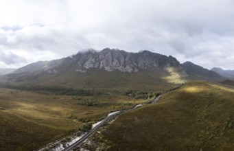 An aerial view of Gordon River Rd at the Sentinel range of mountains near Bitumen Bones Sculpture