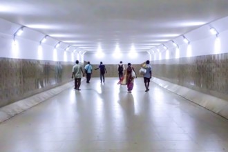 People walking in underpass, Lake Town, Kolkata, West Bengal, India, Asia