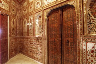 Painting on wall and wooden door in gallery of Gajraj Mahal in Junagarh fort, Bikaner, Rajasthan,