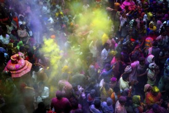 People throwing colored powder Banke Bihari Temple, Uttar Pradesh, India, Asia
