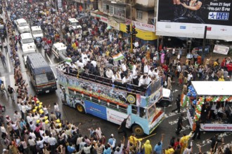 Twenty 20 team wave tri color Indian flags in special decorated bus during victory procession,
