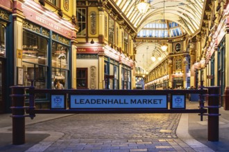 London Leadenhall Market entrance showcases stunning Victorian architecture, warm lighting, and