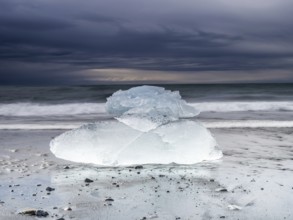 Diamond Beach, iceberg in the surf on the black lava beach, near Jökulsarlon glacier lagoon,