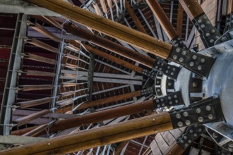 View of wooden observation tower taken from ground level looking up through levels of structure in