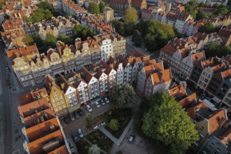 Beautiful panoramic architecture of old town in Gdansk, Poland at sunrise. Aerial view drone pov.