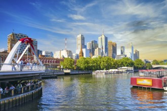 Evening atmosphere in Melbourne on the Yarra River with the Evan Walker Bridge and Flinders Street