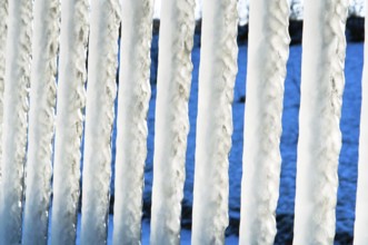 Huge icicles, icing on the sea pier
