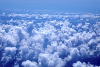 Aerial high view of blue clouds on blue sea