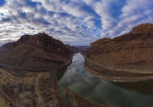 Colorado River and Red Sandstone Mountains on Cloudy Morning. Sky Reflection in Water. Grand