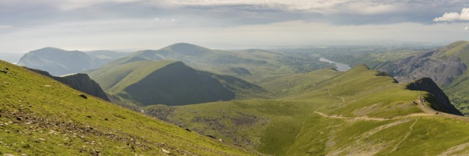 Walking down from Mount Snowdon on the Llanberis Path, Snowdonia, Gwynedd, Wales, UK, looking north