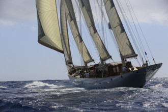 90-year-old sailing yacht Three-masted topsail schooner XARIFA sails during Monaco Classic Week.