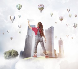 Concept of careless happy childhood with girl dreaming about future