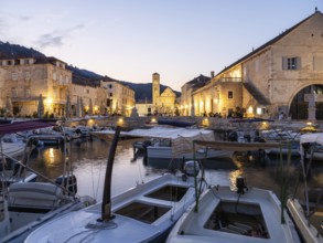 Morning atmosphere, boats in the old harbour, St. Stephen's Cathedral in the background, town of