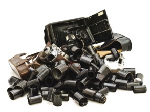 Retro Photo Accessory With Many Films And Vintage Cameras Against The White Background Daugavpils,