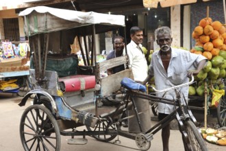 Man with Tricycle rickshaw, Madurai, Tamil Nadu, India