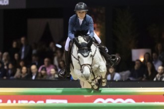 Zascha Nygaard Lill of Denmark competes in the equestrian Audi Grand Prix at Jumping International