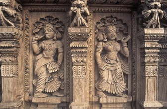 Decorative pieces of women wooden carving statues in old temple chariot at Madurai, Tamil Nadu,