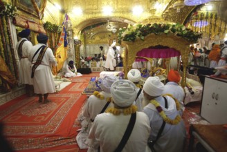 Sikh clerics sitting, celebrations consecration of perpetual Guru Granth Sahib Sikh, Sachkhand
